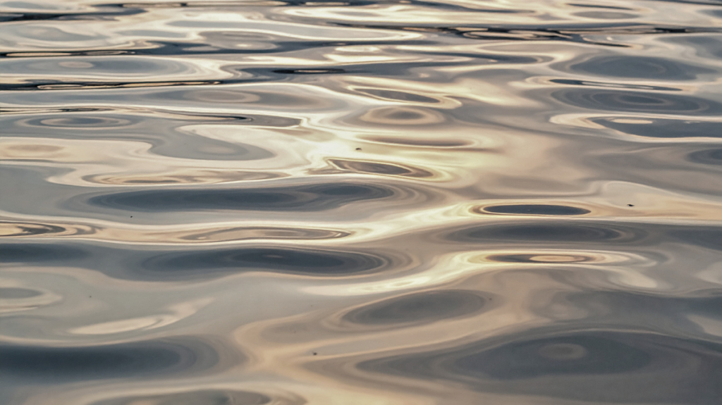Soft reflections moving across calm water