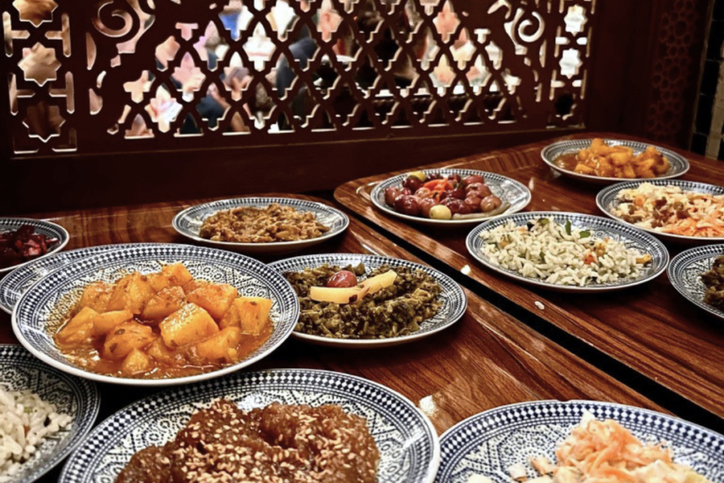 Traditional Moroccan dishes served on patterned ceramic plates